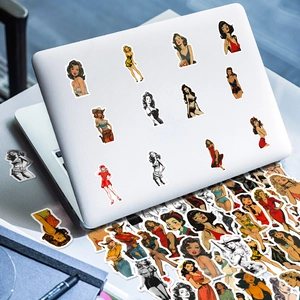 Vintage pin-up girl aesthetic stickers applied to a white laptop for decoration