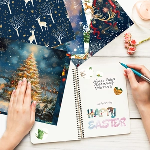 Flat lay of vintage Christmas scrapbook papers with reindeer and snowy forest patterns