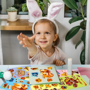 Girl creating Thanksgiving crafts with turkey and squirrel DIY sticker sets