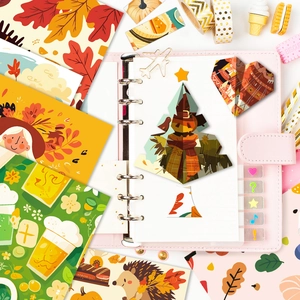 Detail view of autumn harvest scrapbooking stickers featuring pumpkins and maple leaves