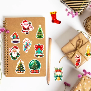Detailed view of Christmas stickers featuring Santa, trees, and bells for DIY crafts
