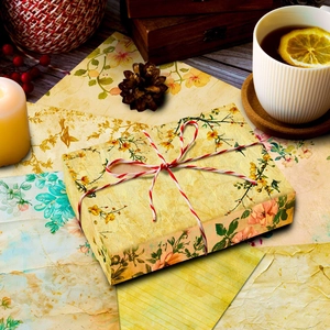 Detailed view of vintage floral craft paper used as gift wrap with cotton twine on a box
