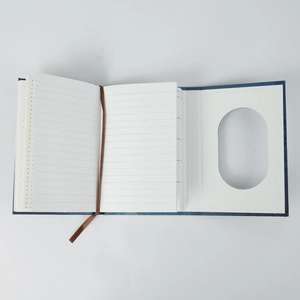 Detail of vintage notebook with ribbon bookmark and mixed grid ruled inner pages
