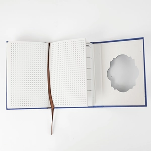 Detail view of Van Gogh starry night notebook with dotted grid pages and silk bookmark