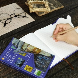 Detail of Van Gogh art notebook with lined pages and vintage aesthetic desk setup