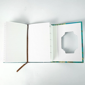 Detail of Van Gogh Almond Blossom notebook with dot grid pages and shield cutout