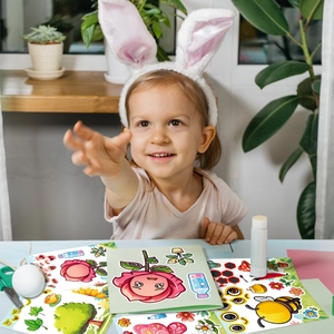 A young girl creates DIY insect stickers with colorful flower and bee designs at a table