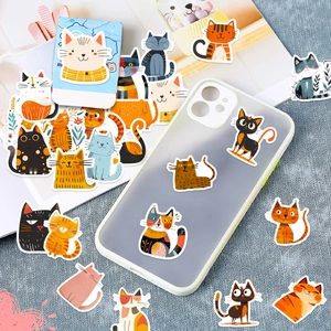 Waterproof cartoon cat stickers shown on a clear phone case with a soft fabric background