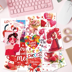 Flat lay of romantic Valentine card set with hearts and flamingos on an office desk