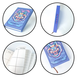 Detail of purple Chinoiserie dragon notebook showing hardcover spine and daily planner pages