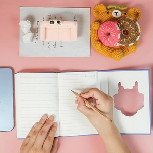 Detail of creative dragon notebook with ruled pages and unique cutout design feature