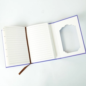 Detail view of purple fairytale notebook with wavy hollow window and ribbon bookmark