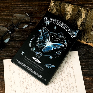 Portable black tri-fold notebook with a blue butterfly and celestial star design
