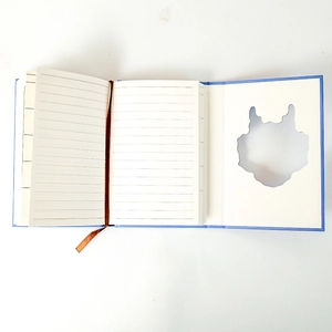 Detail view of the notebook interior with lined paper, bookmark and Totoro cutout
