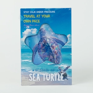 Detail view of sea turtle ocean wave hardcover notebook with star cutout window design
