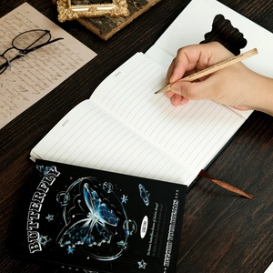 Portable tri-fold liquid butterfly notebook with ruled pages and bookmark for journaling
