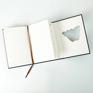Detail of A5 black hardcover notebook featuring a unique cutout window and bookmark