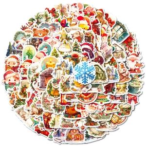 Vue à plat d'autocollants de Noël colorés avec le Père Noël et des rennes sur fond blanc