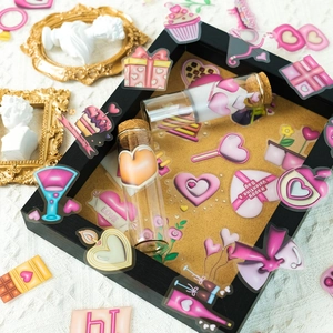 Flat lay of Valentine stickers with hearts and champagne on white knit background