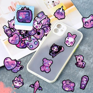 Gothic purple stickers displayed on a phone case and magazines for DIY decoration