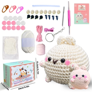 DIY crochet kit featuring white and pink bunny dolls with yarn, tools, and accessories