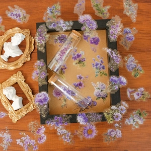 Macro detail of waterproof purple PET floral stickers with transparent glass jars