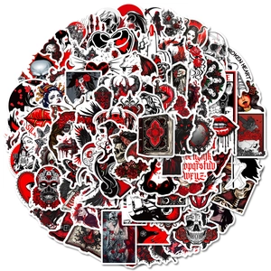 Flat lay of gothic stickers with skulls and roses in dark red and black colors