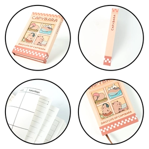 Detail view of the pink Capybara series hardcover notebook showing interior grid pages
