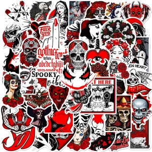 Macro view of gothic horror stickers featuring dark red skulls and punk art motifs