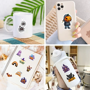 Waterproof Halloween stickers featuring pumpkins, ghosts, and castles on laptop and water bottle