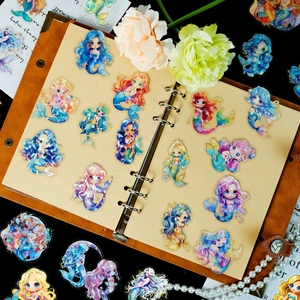 Holographic mermaid cartoon stickers set on a leather notebook with a shiny PET finish