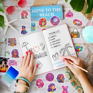 Close-up of pink Y2K pop art stickers on a summer themed desk with seaside decor