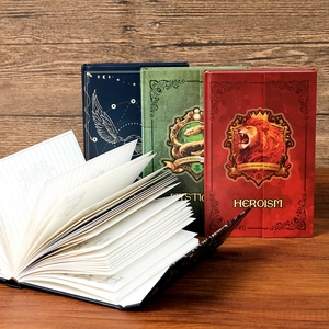 Detail view of lined pages and hard covers of magic academy themed trifold notebooks
