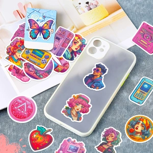 Close-up of waterproof pink and purple Y2K stickers on a textured background and phone case