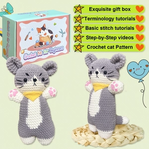 DIY crochet kit featuring two grey and white cats with yellow scarves and a gift box