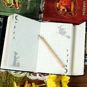 Magic totem hardcover notebook with grid pages and fantasy witch illustrations