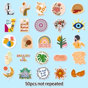 Flat lay of 50 unique bohemian waterproof stickers with floral and retro art designs
