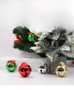 Macro shot of colorful Joy and Merry Christmas electroplated bells with bows