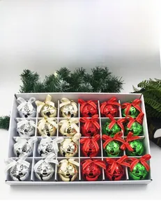 Close-up of 24 colorful Christmas bells with Joy and Noel prints in a gift box