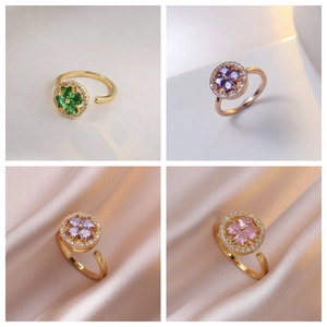 Adjustable floral gold ring set with purple and green zircon crystals in four styles