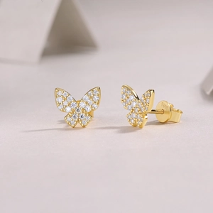 Detailed view of S925 sterling silver butterfly stud earrings with sparkling pavé zircons