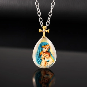 Religious necklace with teardrop Madonna pendant and gold cross on silver chain