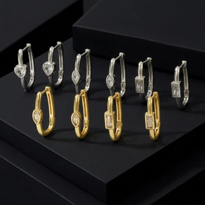 U-shaped heart drop earrings with gold and silver finishes and crystal zircons