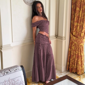 Detailed view of brown polka dot crop top and matching tiered maxi skirt for summer