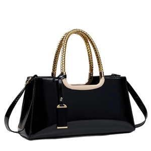 Glossy black patent leather handbag for women featuring a luxury gold woven top handle