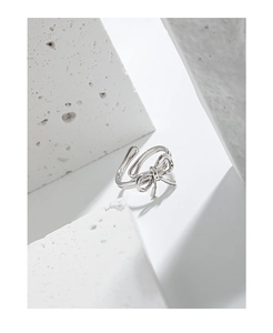 Macro shot of S925 sterling silver hallmark on the minimalist bow-shaped open ring