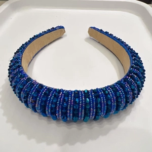 Detail of blue crystal beaded padded headband showing navy beads and velvet lining