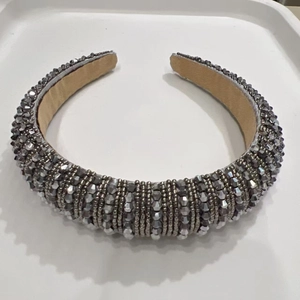 Macro detail of handmade beaded sponge headband with grey crystals and soft velvet lining
