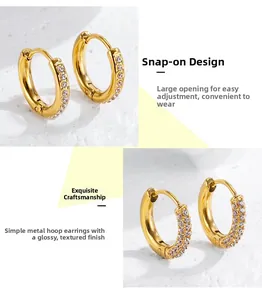 Detail of gold stainless steel hoop earrings with micro-inlaid cubic zirconia crystals
