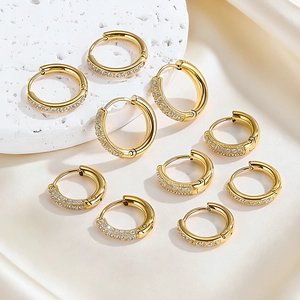 Exquisite gold hoop earrings set with pavé cubic zirconia on minimalist display